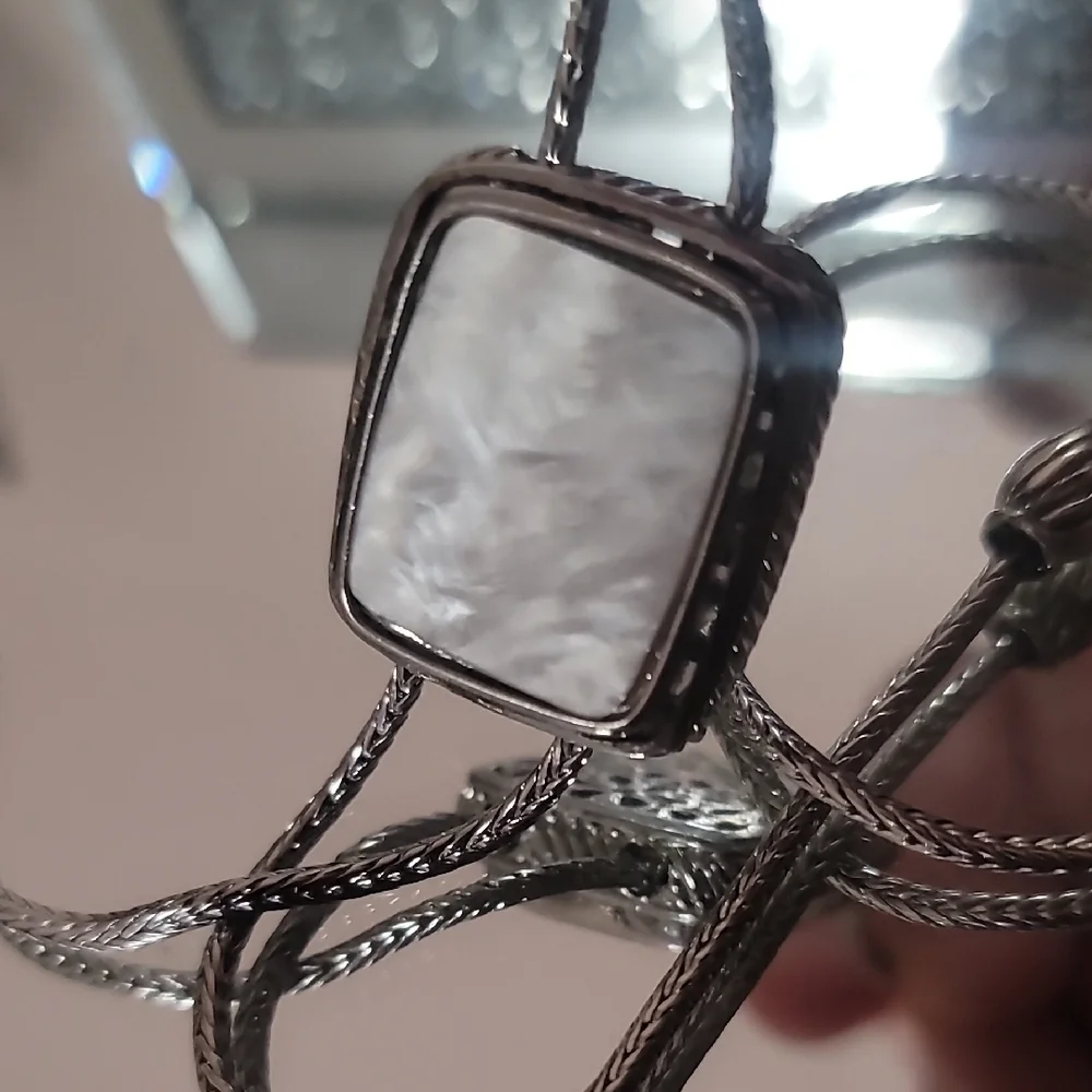 NWOT Silver Bolo Tie With Mother Of Perl Accent.